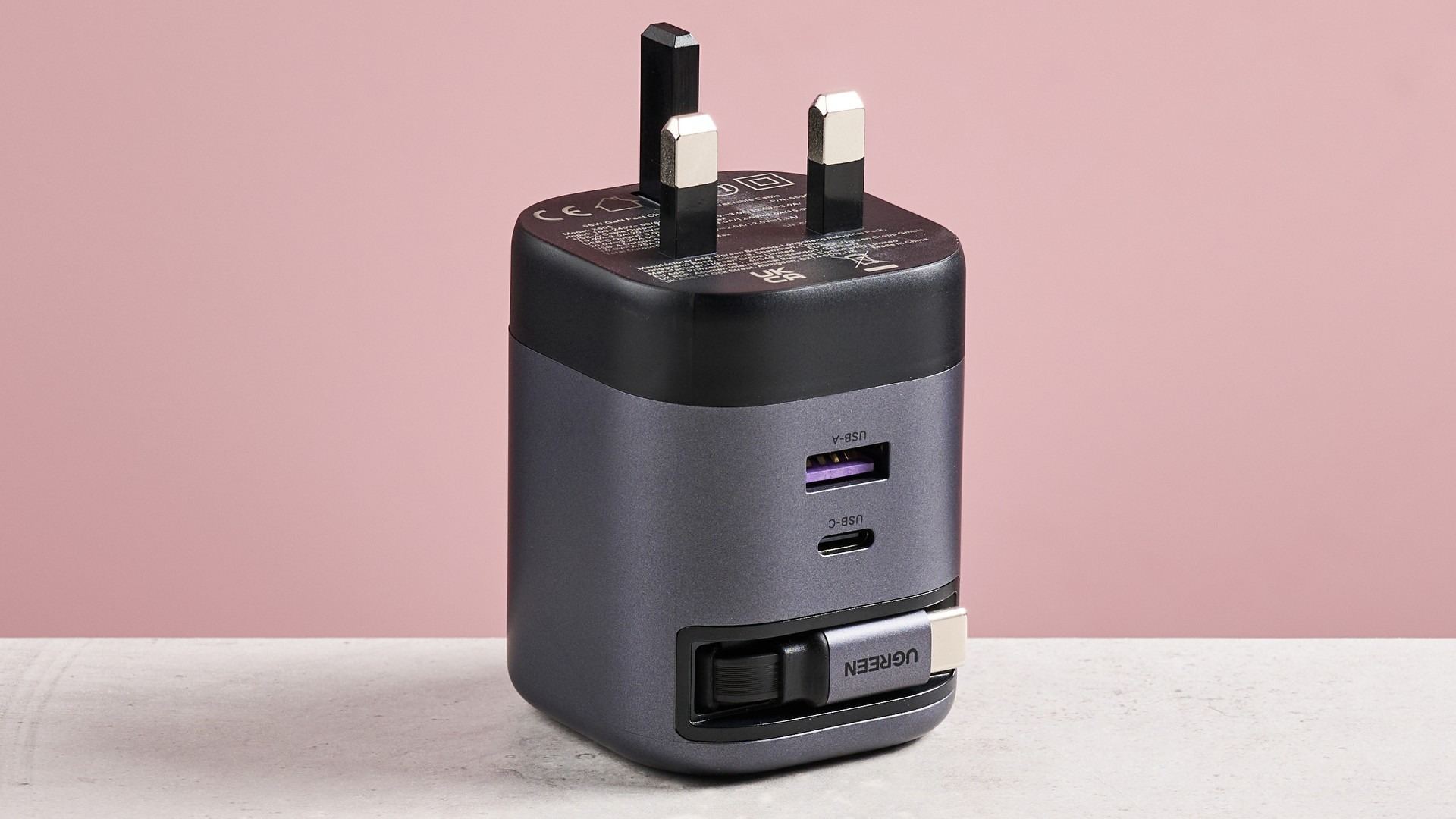 UGreen Nexode retractable charger photographed on a table.